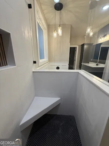 a view of a hallway with seating area