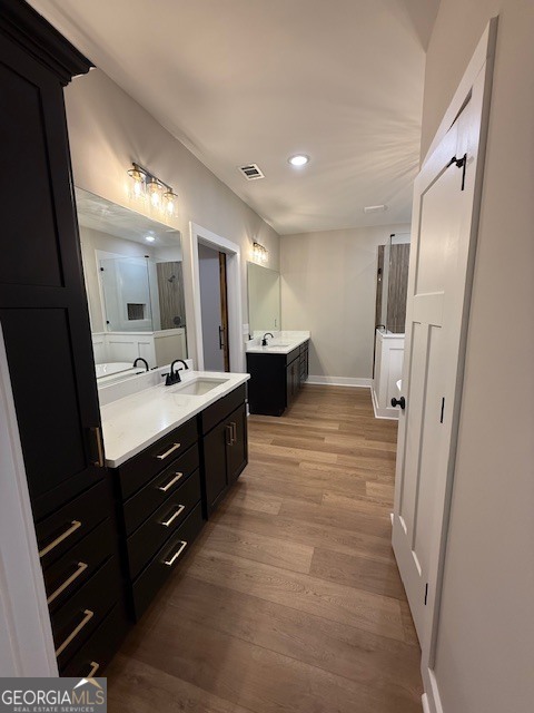 603 Silver Dollar Road Barnesville, GA 30204 - Photo 24 of 33 a bathroom with a double vanity sink and mirror