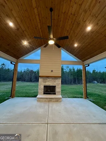 a view of a porch in front of a house with a yard