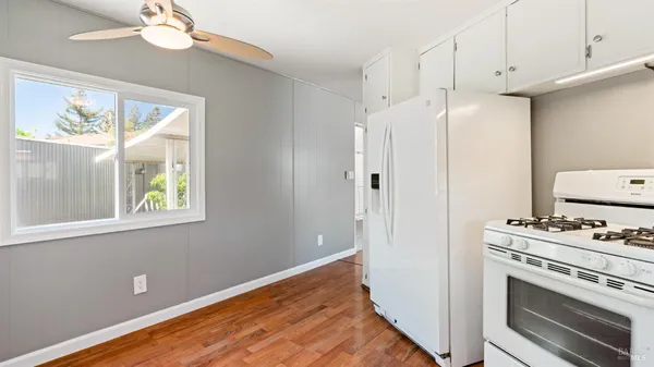 a kitchen with a stove and a refrigerator