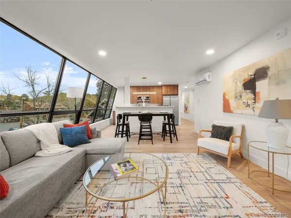 a living room with furniture and a table