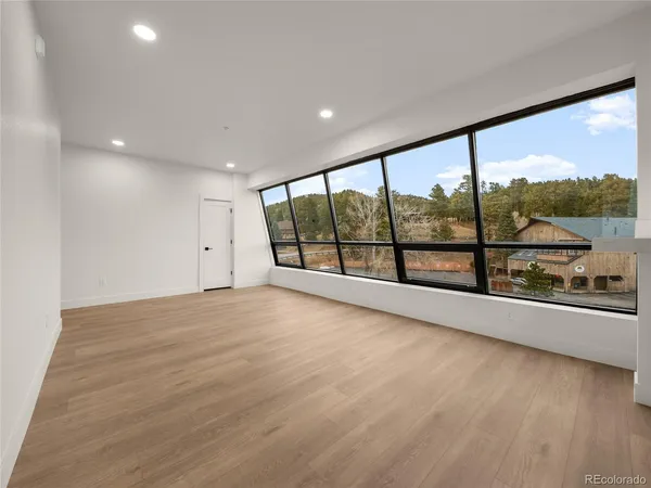 a view of an empty room with a large window