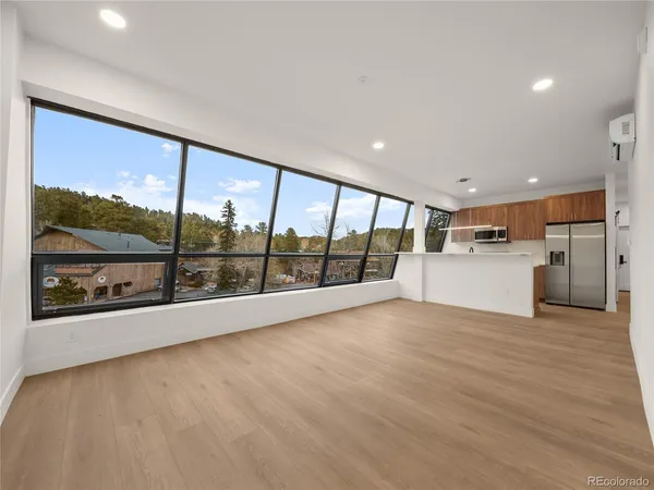 a view of an empty room with a large window