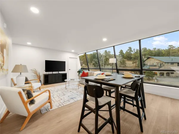 a view of a dining room with furniture window and outside view