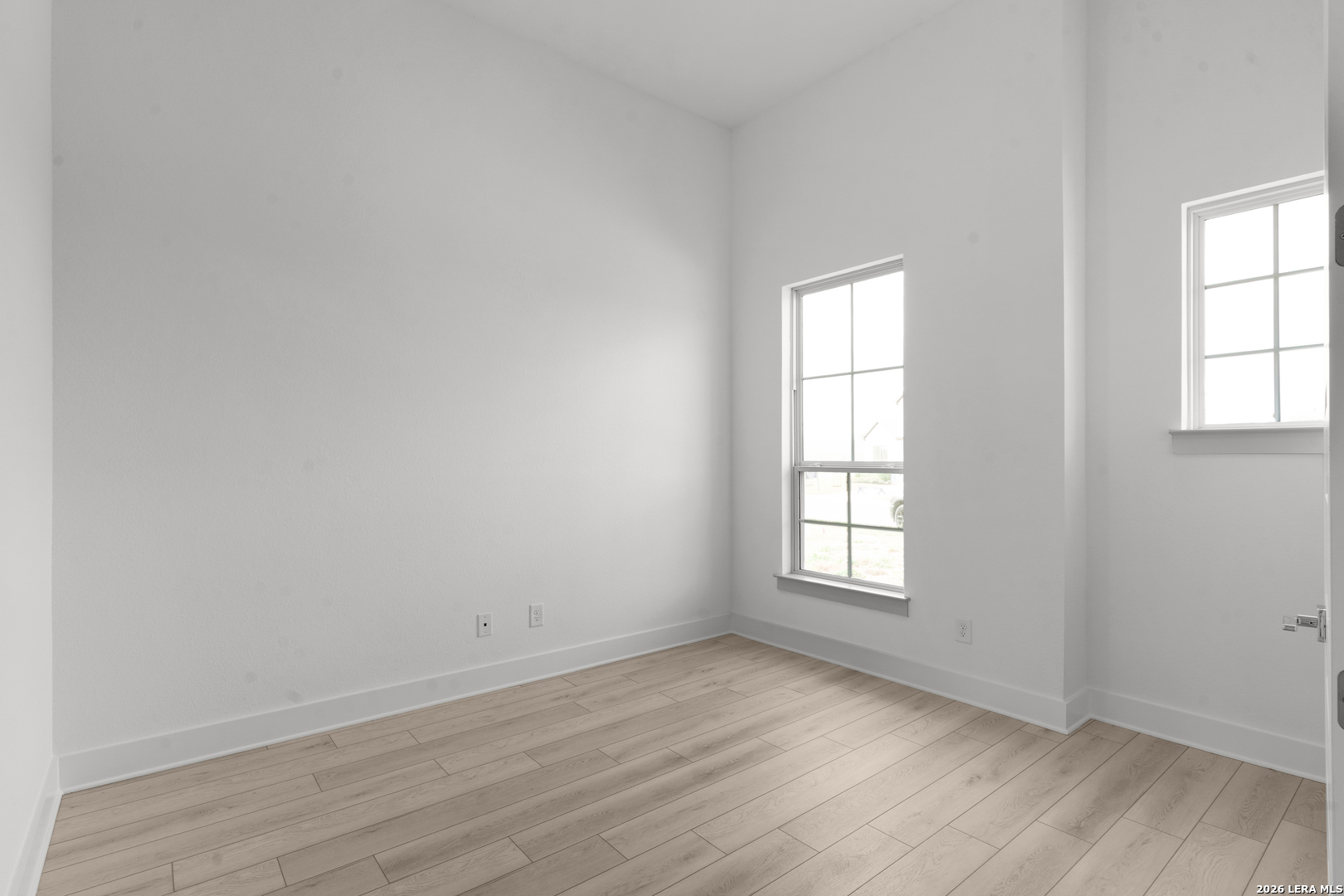 940 Nolte Bend Seguin, TX 78155 - Photo 7 of 19 an empty room with wooden floor and window