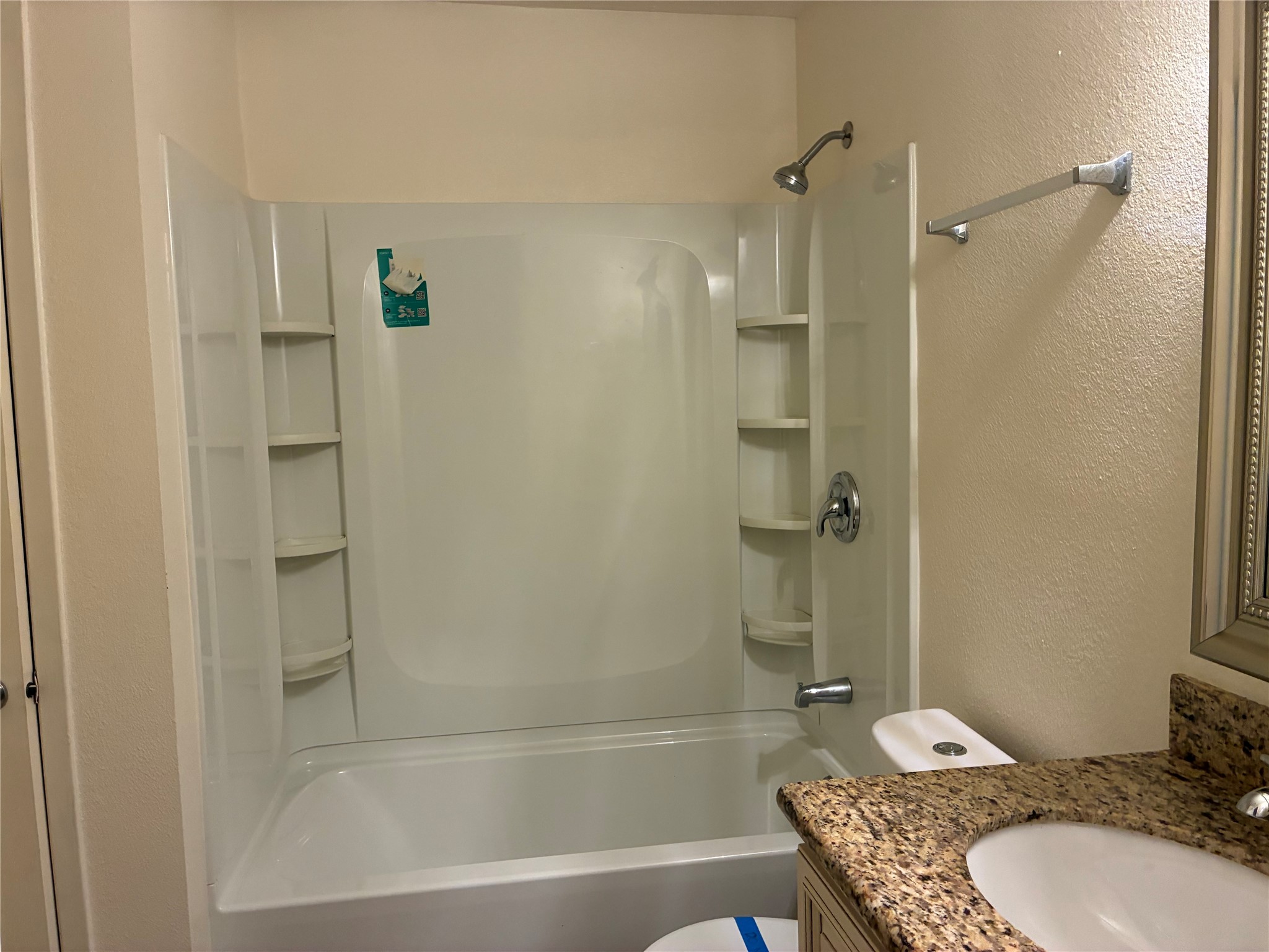 6401 Deihl Road, Unit 1011 Houston, TX 77092 - Photo 11 of 16 a bathroom with a granite countertop sink toilet and shower