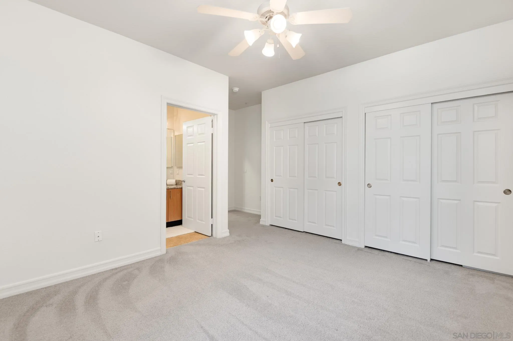 1465 C Street, Unit 3301 San Diego, CA 92101 - Photo 12 of 31 an empty room with a ceiling fan and bathroom