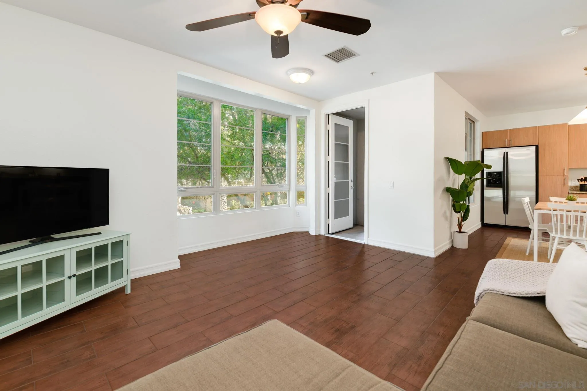 1465 C Street, Unit 3301 San Diego, CA 92101 - Photo 2 of 31 a view of livingroom with furniture wooden floor and window