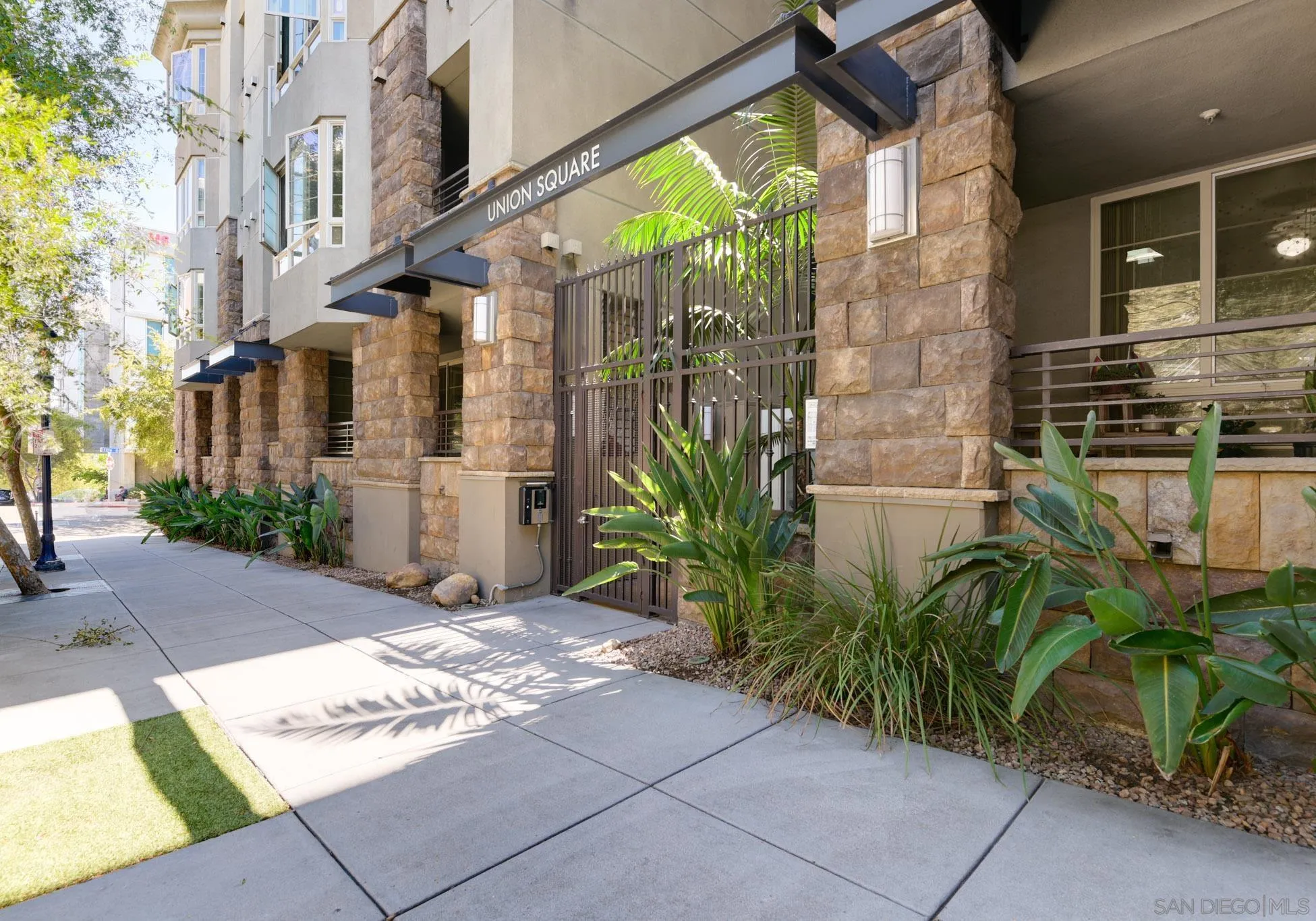 1465 C Street, Unit 3301 San Diego, CA 92101 - Photo 21 of 31 a view of a brick buildings with many windows