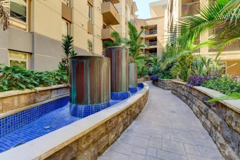 a view of a building with a backyard porch and sitting area
