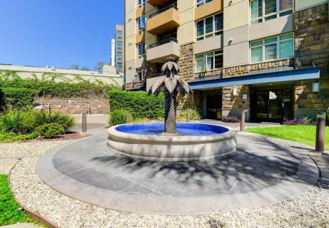 a view of a balcony with wooden floor and fence