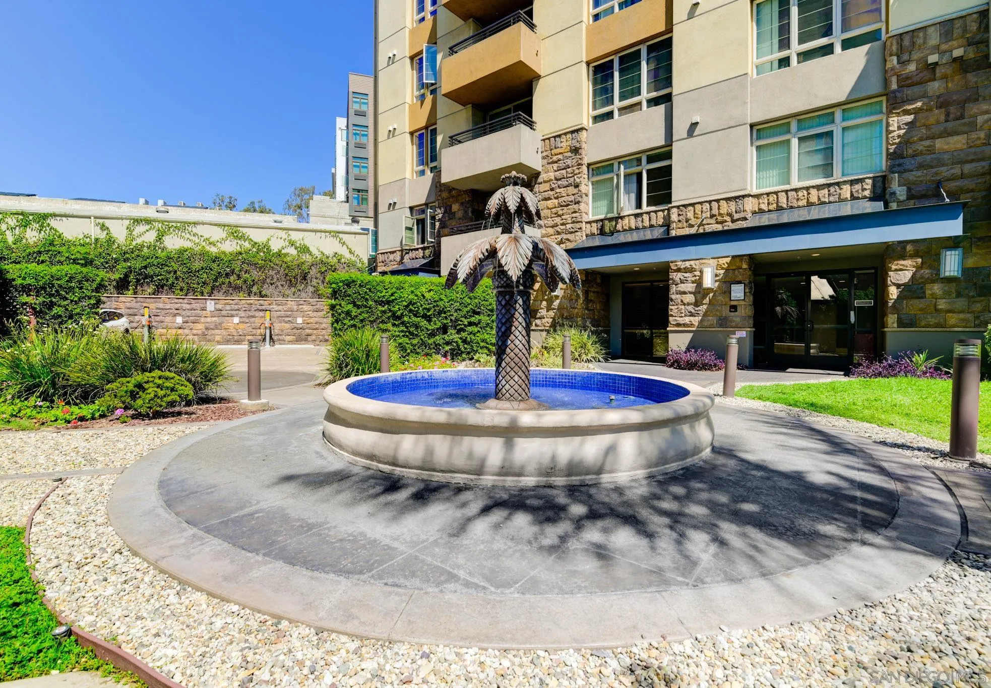 1465 C Street, Unit 3301 San Diego, CA 92101 - Photo 24 of 31 a view of a building with a backyard porch and sitting area