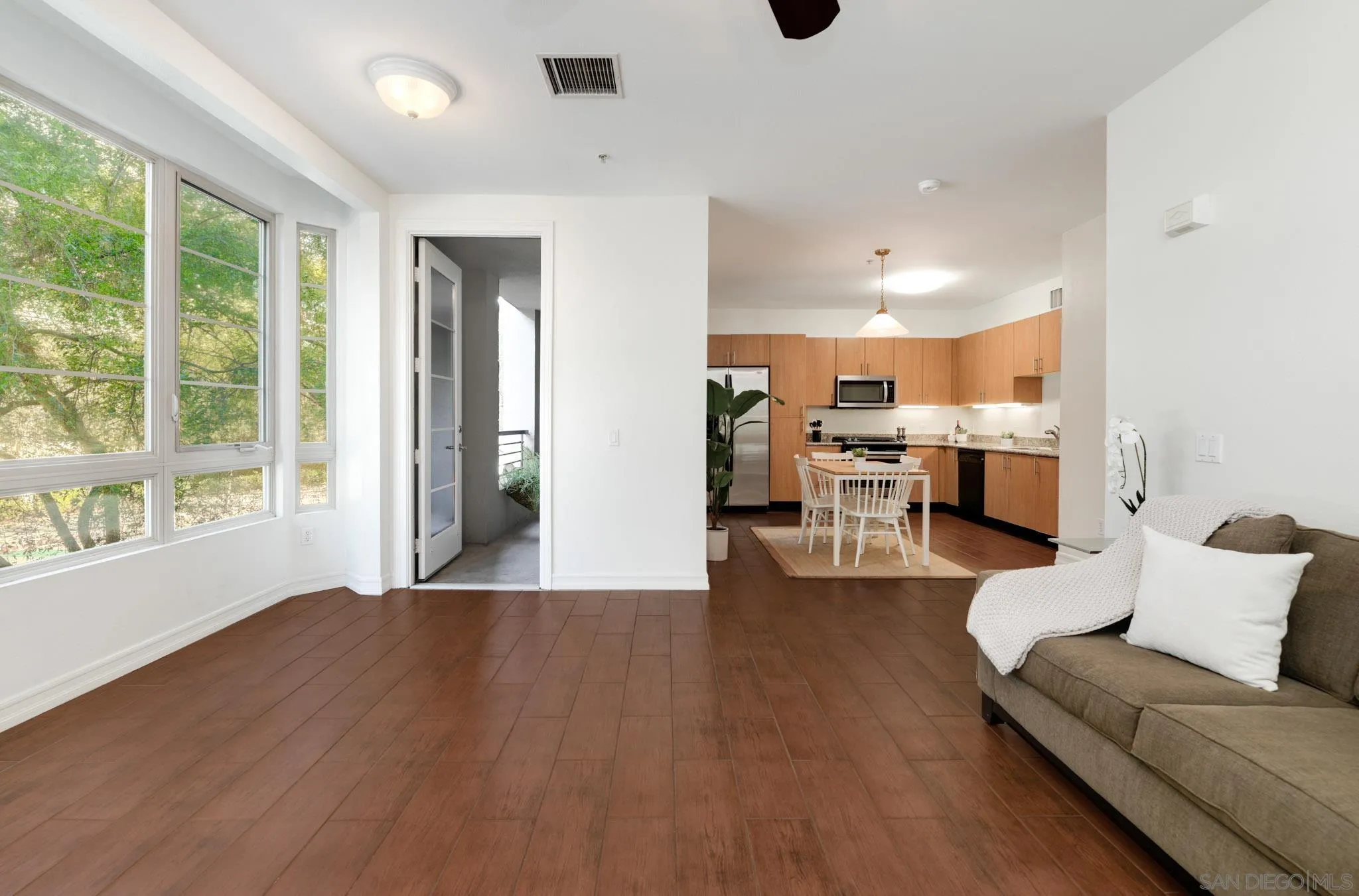 1465 C Street, Unit 3301 San Diego, CA 92101 - Photo 4 of 31 a living room with furniture and a large window
