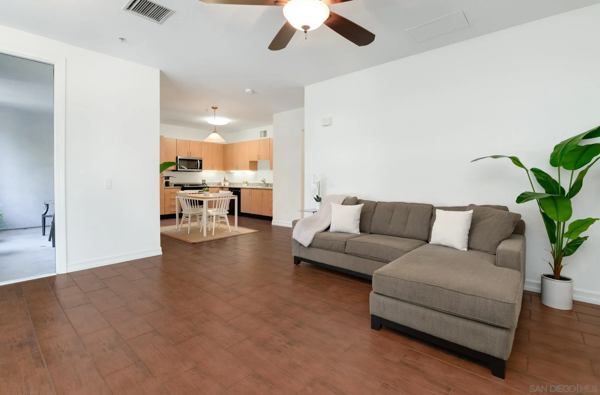 1465 C Street, Unit 3301 San Diego, CA 92101 - Photo 6 of 31 a living room with furniture and a large window