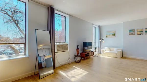 a living room with furniture and a window