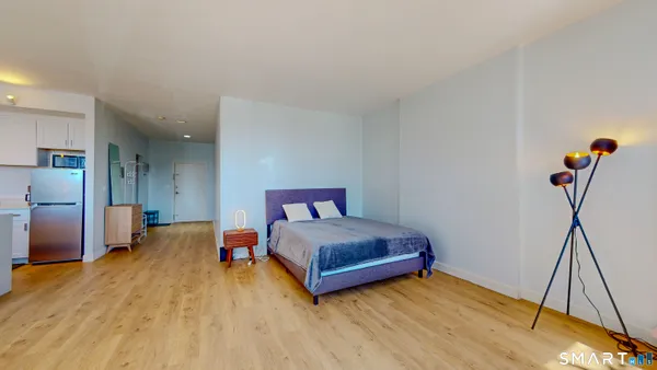 a bedroom with a bed and a table