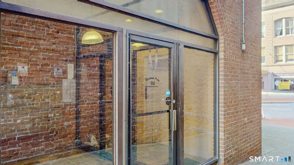 a bathroom with a glass door shower