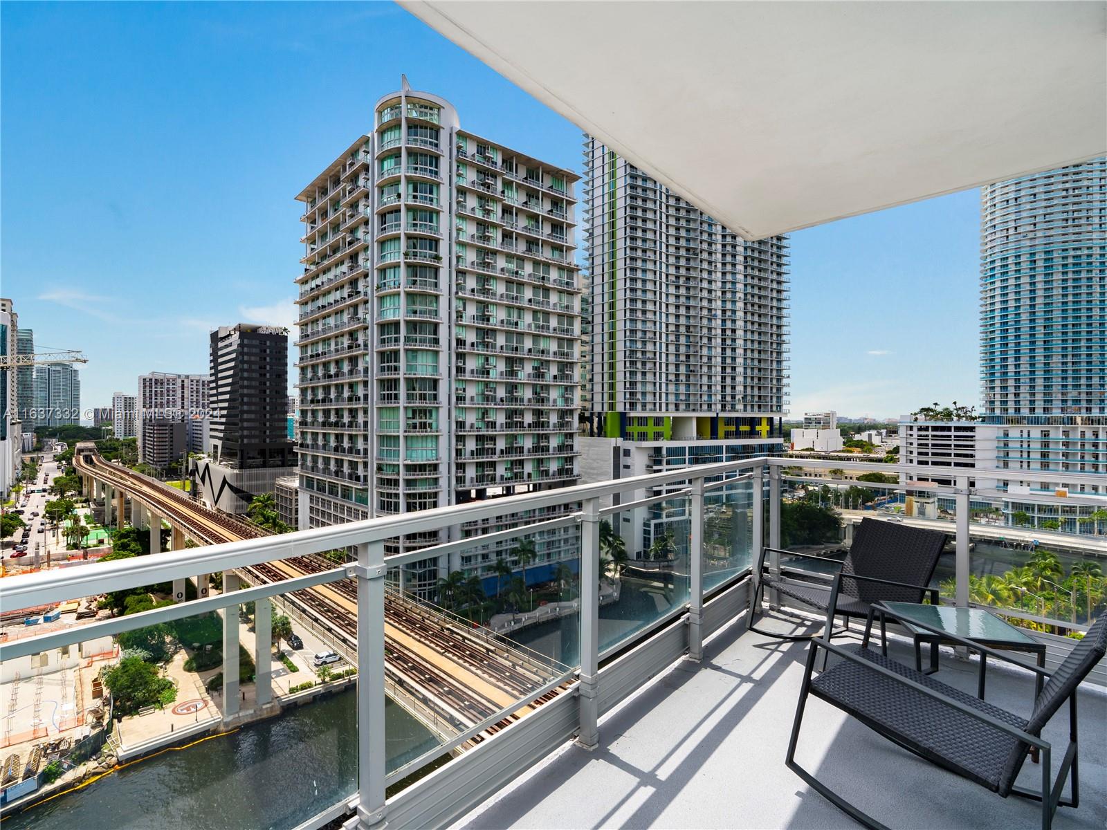 92 Southwest 3rd Street, Unit 1505 Miami, FL 33130 - Photo 4 of 37 a view of balcony with a couple of chairs
