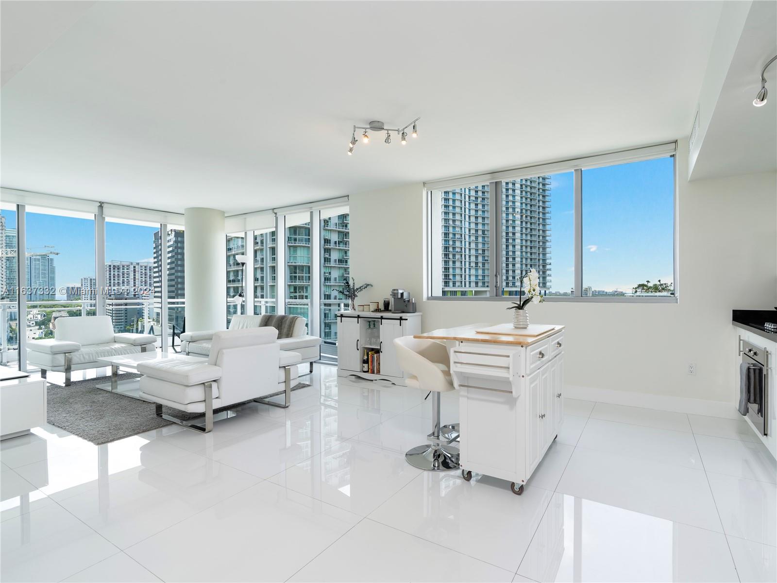 92 Southwest 3rd Street, Unit 1505 Miami, FL 33130 - Photo 7 of 37 a living room with furniture and a large window