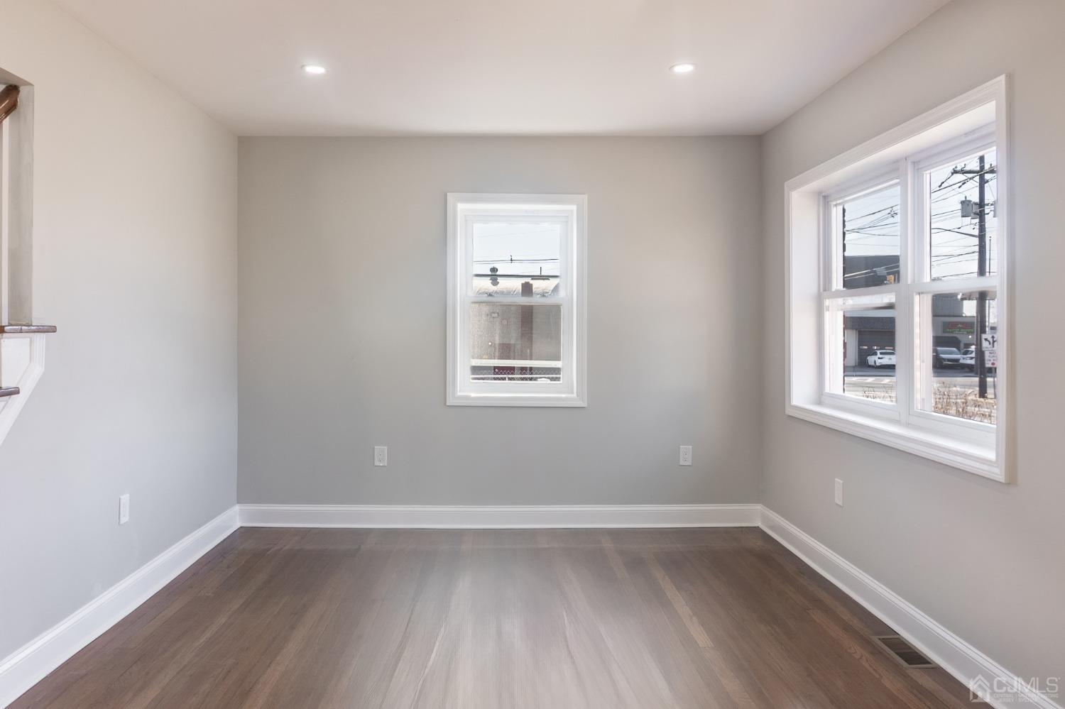 420 Crows Mill Road Fords, NJ 08863 - Photo 10 of 38 a view of an empty room with wooden floor and a window