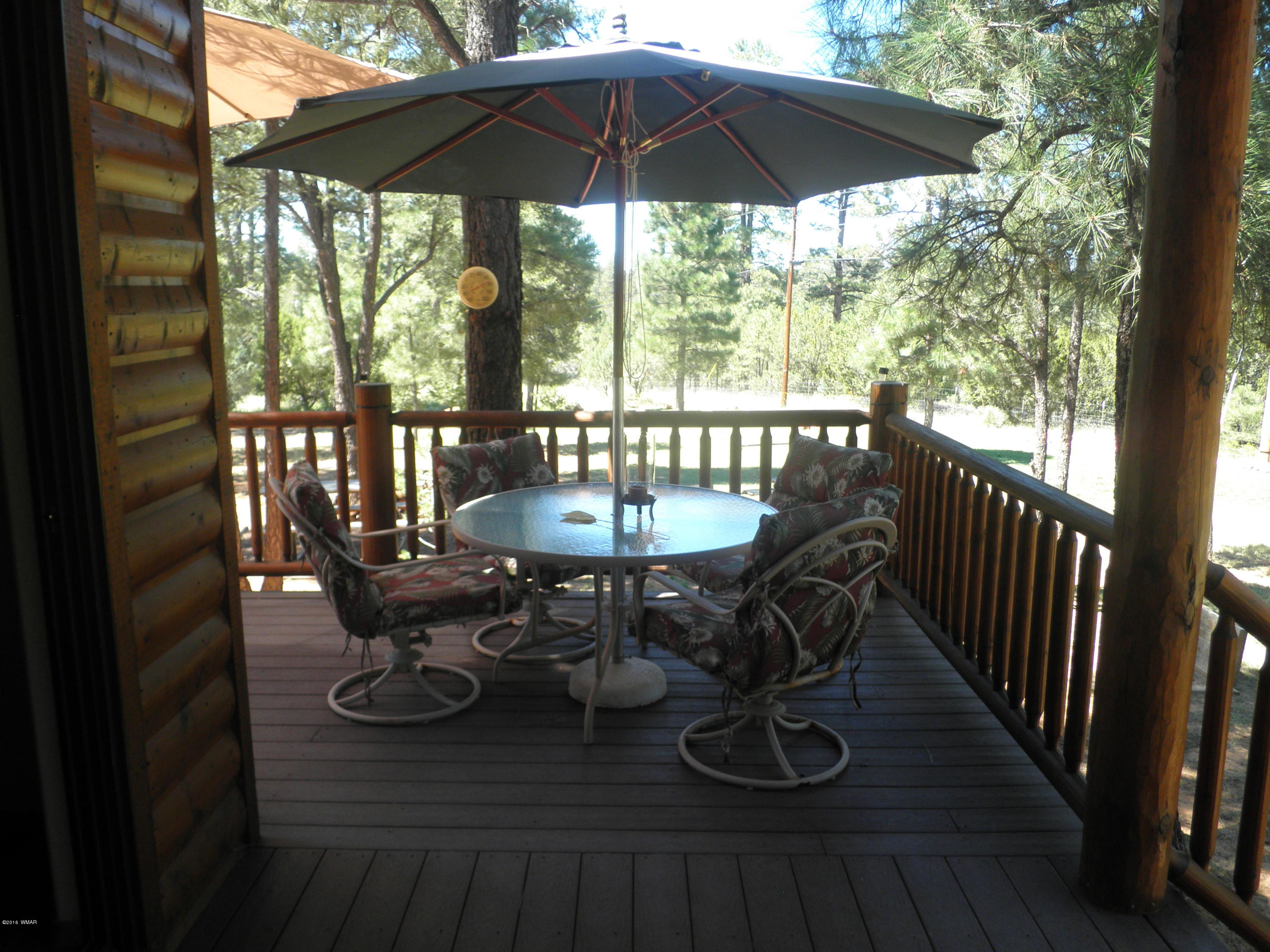 3048 Aspen Road Overgaard, AZ 85933 - Photo 11 of 36 a view of balcony with furniture and wooden floor