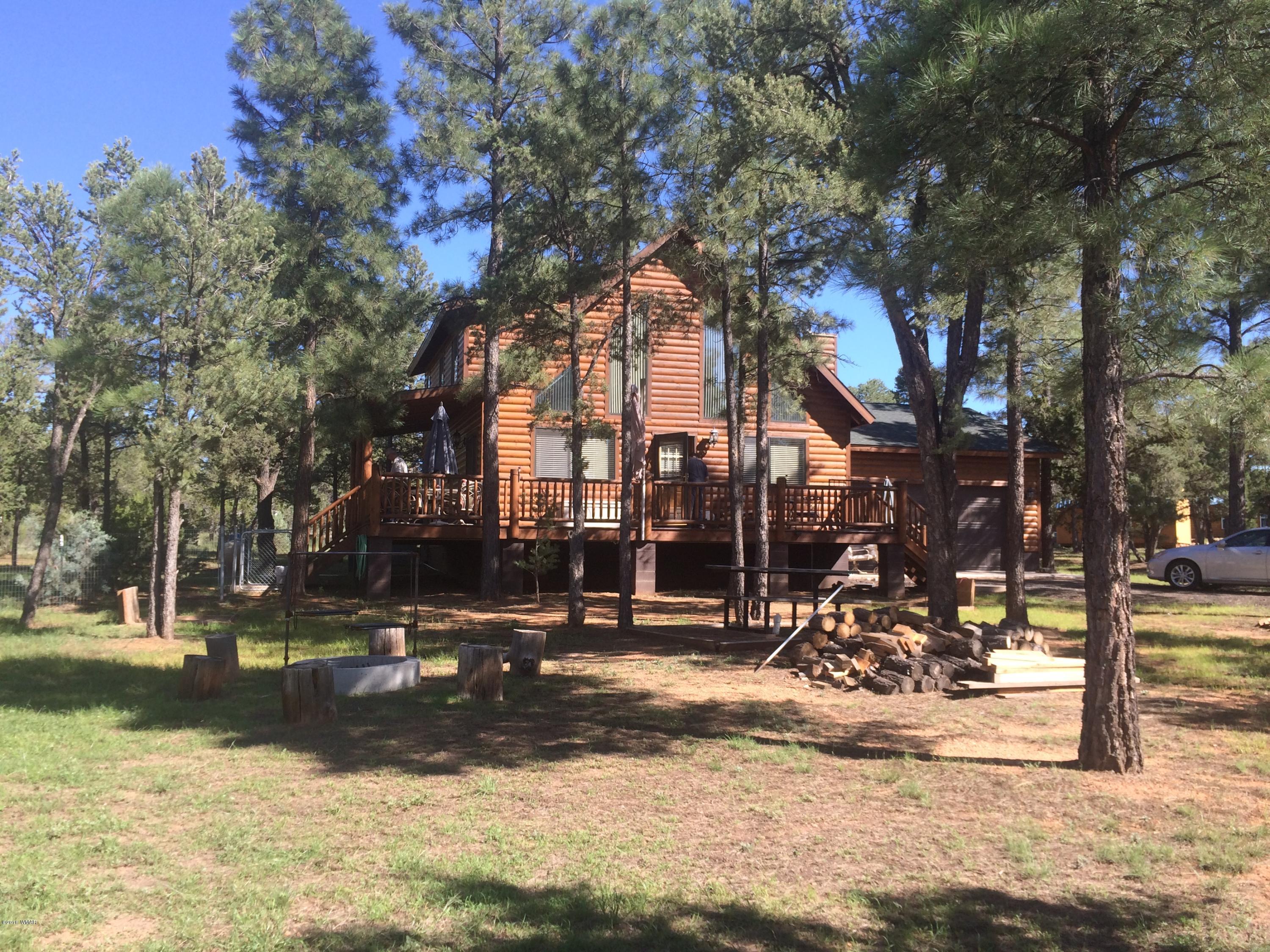 3048 Aspen Road Overgaard, AZ 85933 - Photo 2 of 36 a view of street with large trees