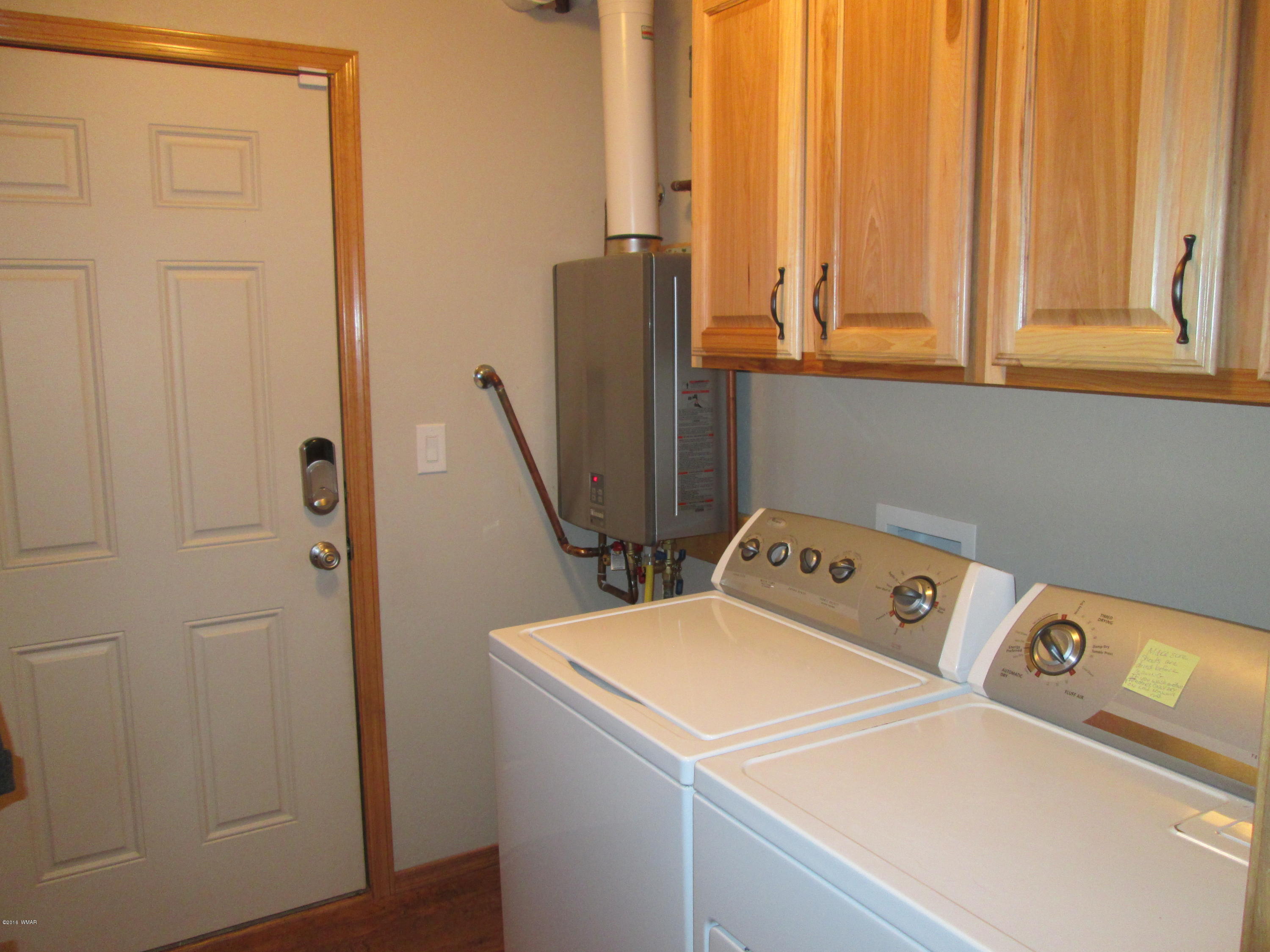 3048 Aspen Road Overgaard, AZ 85933 - Photo 30 of 36 a utility room with dryer and washer