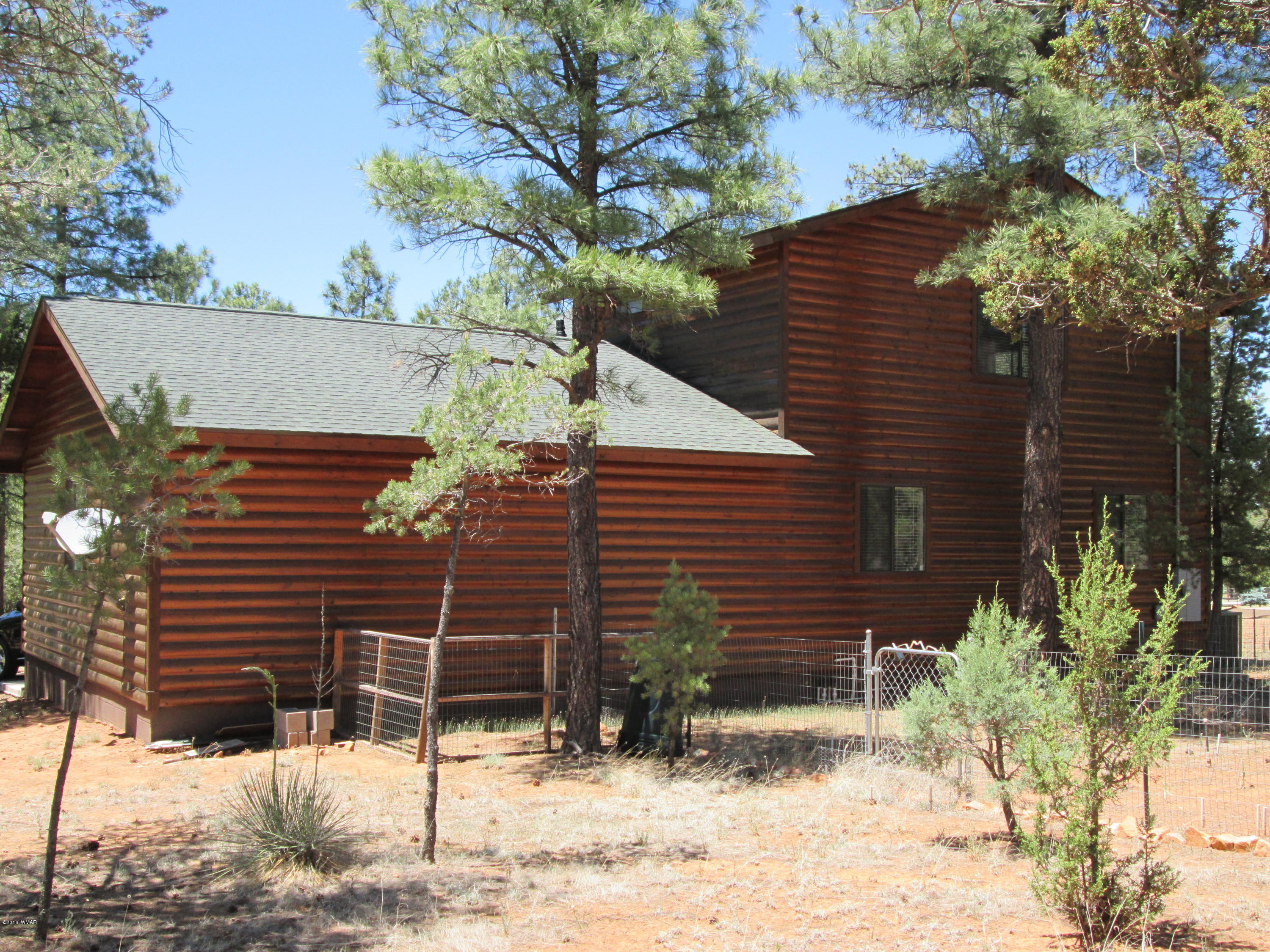 3048 Aspen Road Overgaard, AZ 85933 - Photo 3 of 36 a view of a house with a yard
