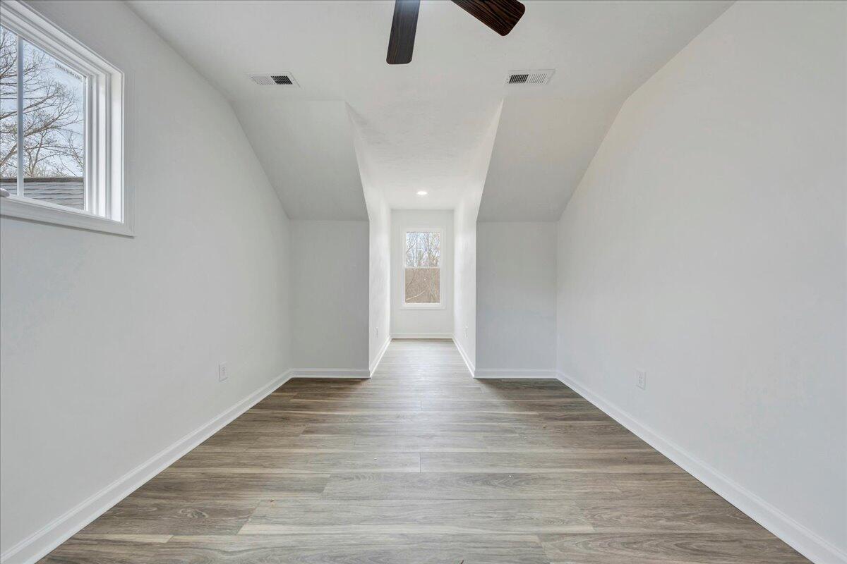 610 Gap Bridge Road Moneta, VA 24121 - Photo 19 of 62 a view of an empty room with window and wooden floor