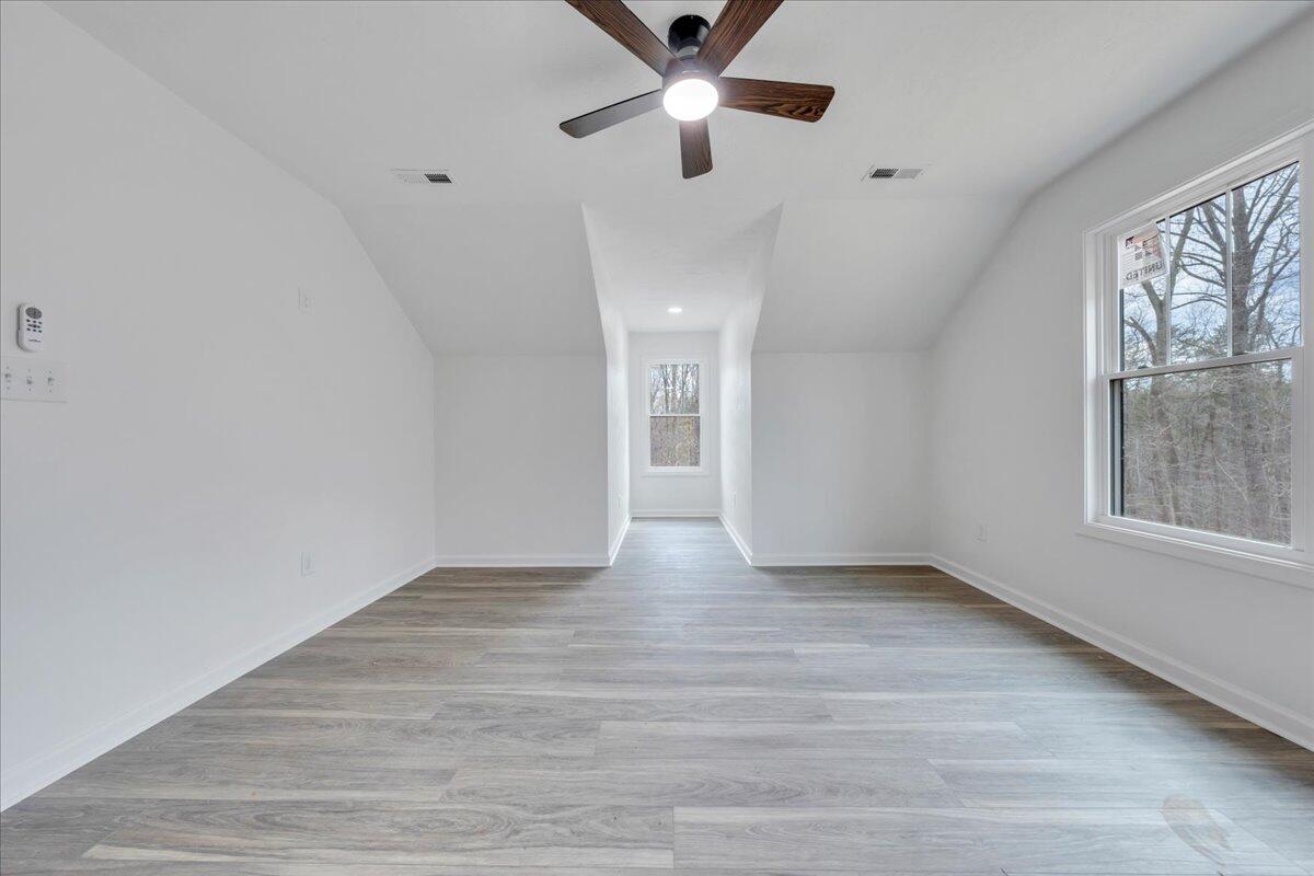 610 Gap Bridge Road Moneta, VA 24121 - Photo 21 of 62 wooden floor in an empty room with a window
