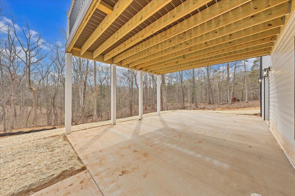 610 Gap Bridge Road Moneta, VA 24121 - Photo 30 of 62 a view of backyard with wooden fence and large trees