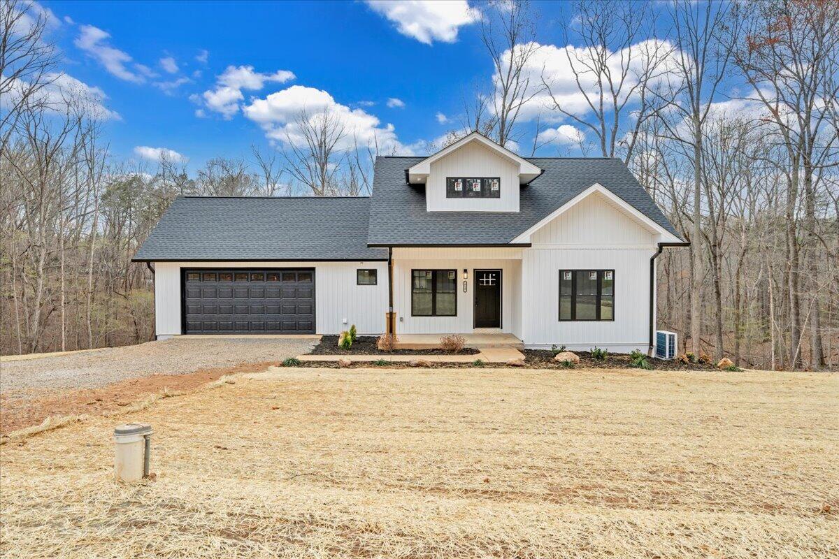 610 Gap Bridge Road Moneta, VA 24121 - Photo 33 of 62 a front view of a house with a yard