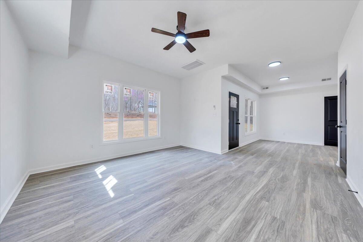 610 Gap Bridge Road Moneta, VA 24121 - Photo 4 of 62 a view of empty room with wooden floor and fan