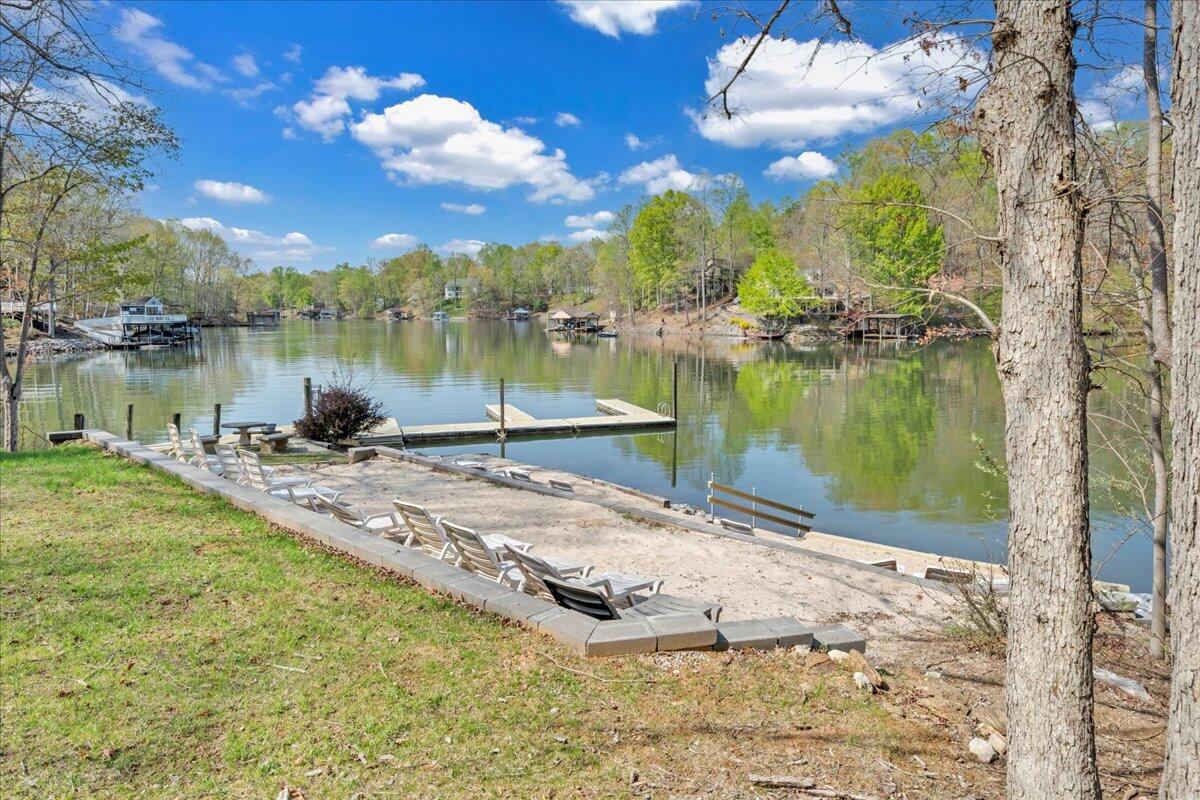 610 Gap Bridge Road Moneta, VA 24121 - Photo 46 of 62 a view of a lake with a yard and potted plants