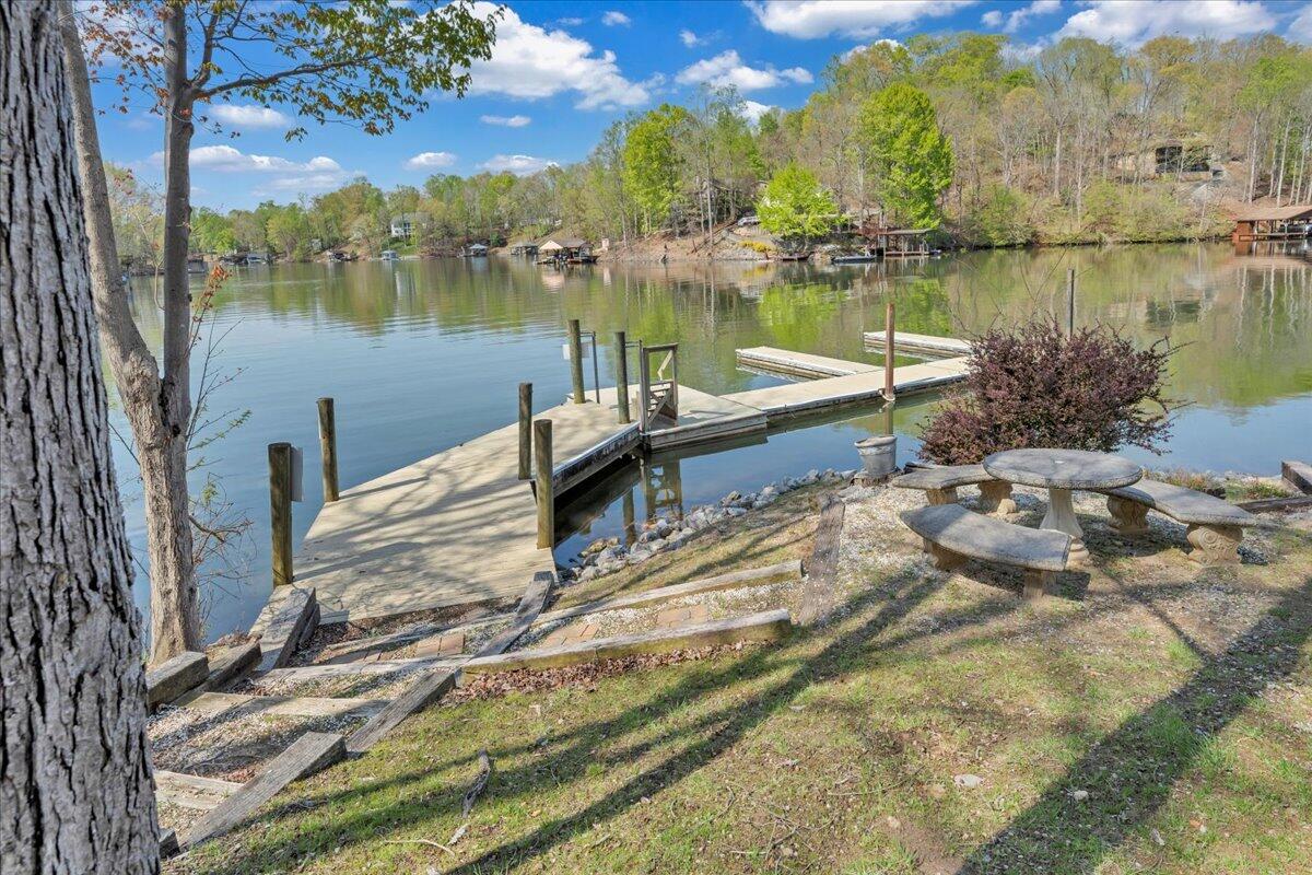 610 Gap Bridge Road Moneta, VA 24121 - Photo 48 of 62 a view of a lake with a yard and a large window