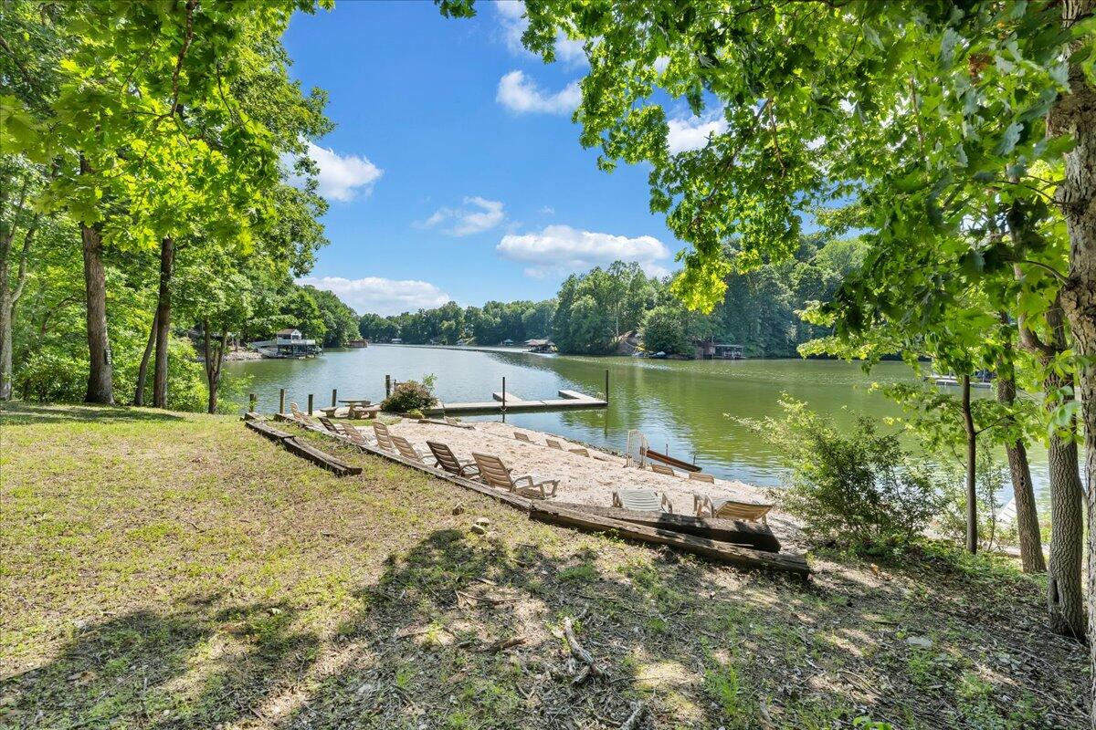 610 Gap Bridge Road Moneta, VA 24121 - Photo 53 of 62 a view of a lake with a yard and large trees