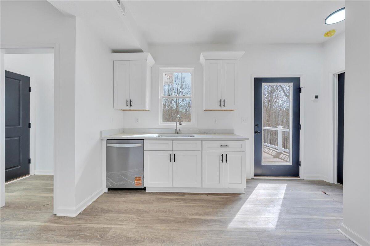 610 Gap Bridge Road Moneta, VA 24121 - Photo 7 of 62 a spacious bathroom with a granite countertop sink and a mirror
