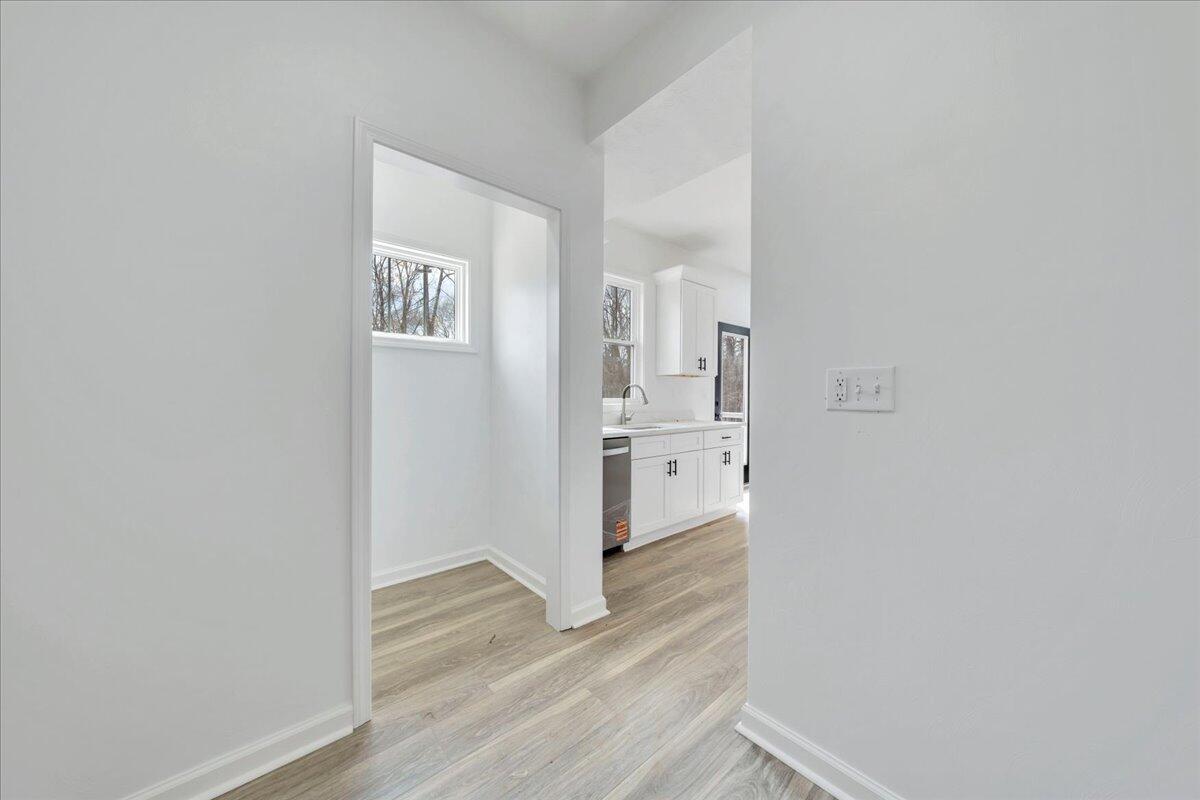 610 Gap Bridge Road Moneta, VA 24121 - Photo 9 of 62 a view of a hallway with wooden floor and closet