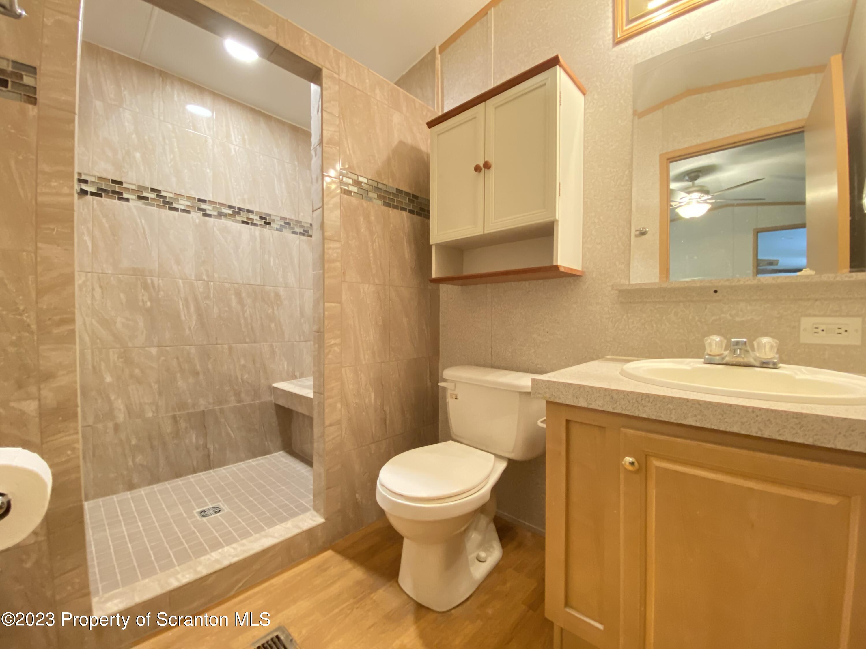 4 Honor Park Moosic, PA 18507 - Photo 14 of 24 a bathroom with a sink a toilet and shower