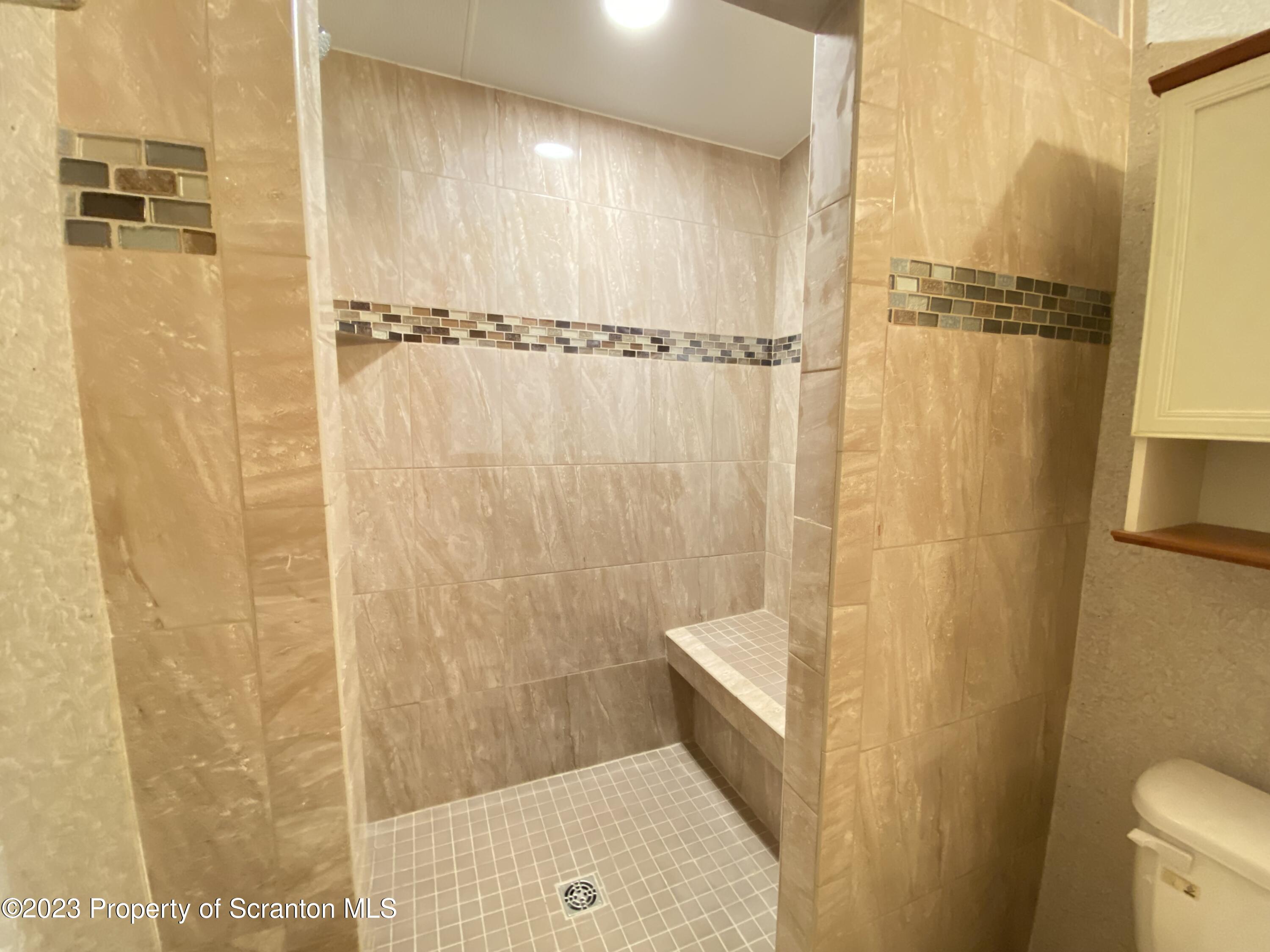 4 Honor Park Moosic, PA 18507 - Photo 17 of 24 a bathroom with a shower