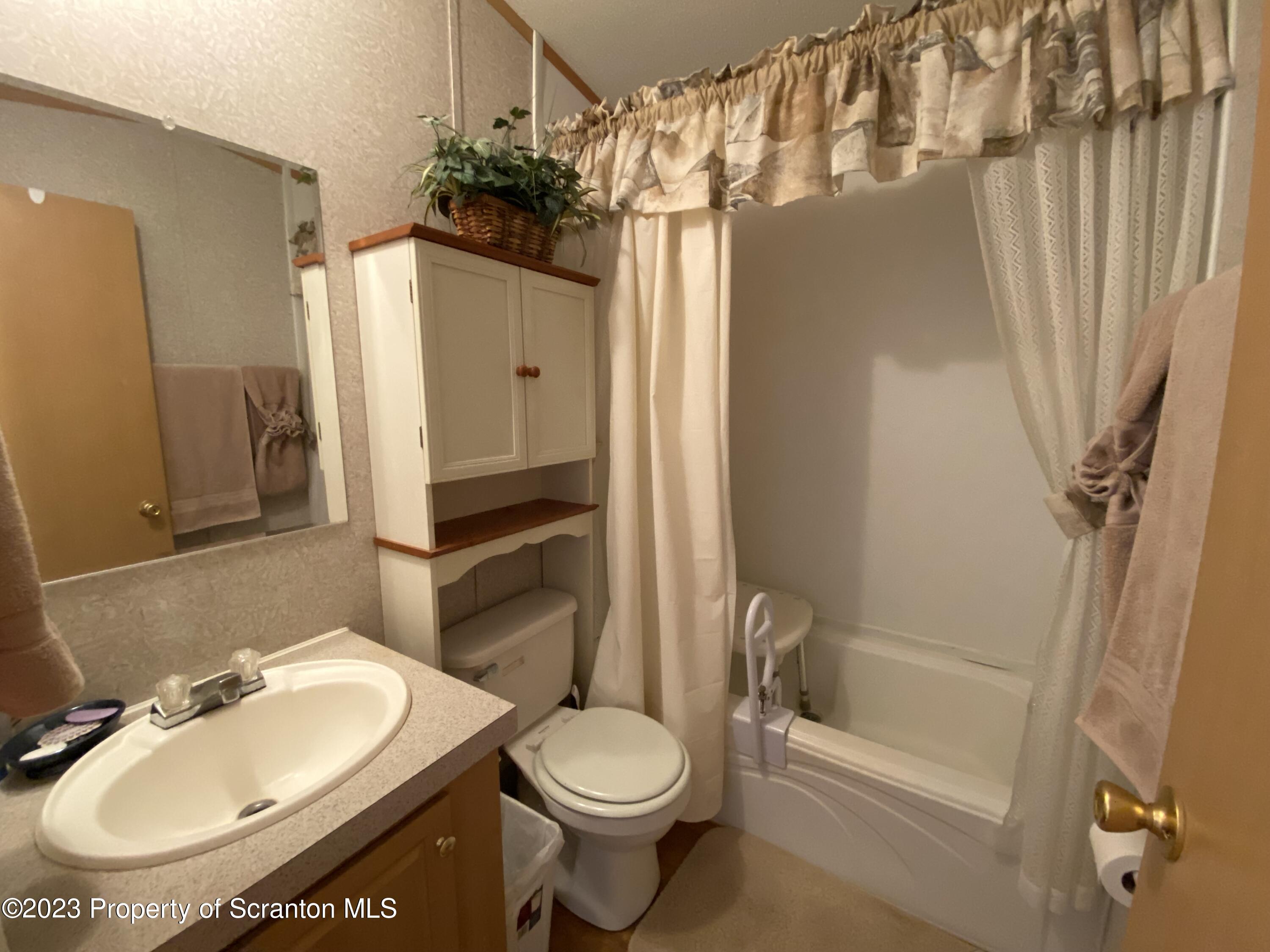 4 Honor Park Moosic, PA 18507 - Photo 21 of 24 a bathroom with a sink toilet and shower