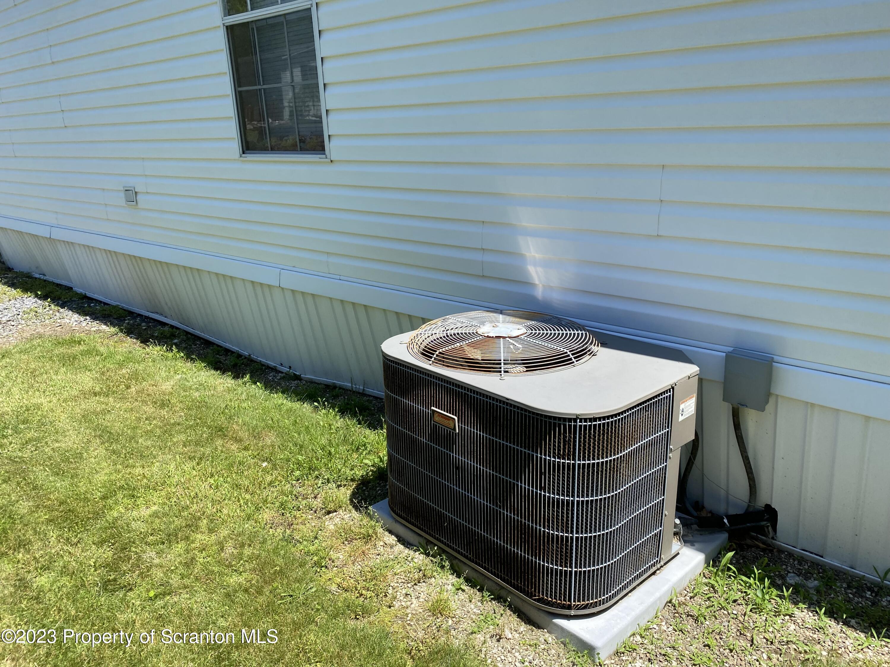4 Honor Park Moosic, PA 18507 - Photo 24 of 24 a wooden bench sitting in a backyard
