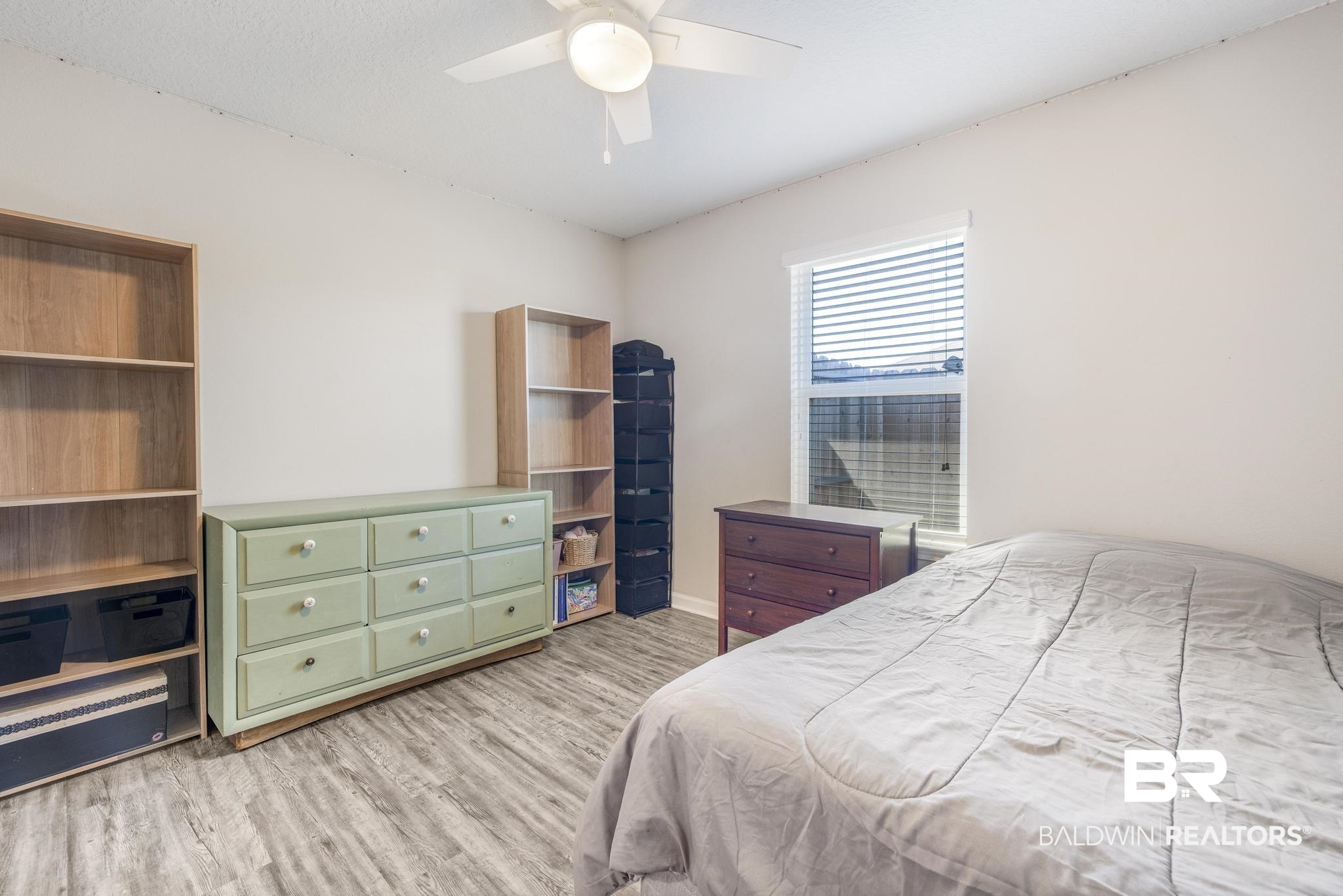 10738 Ridgeview Drive Mobile, AL 36608 - Photo 22 of 48 Bedroom with light wood-style floors and ceiling fan