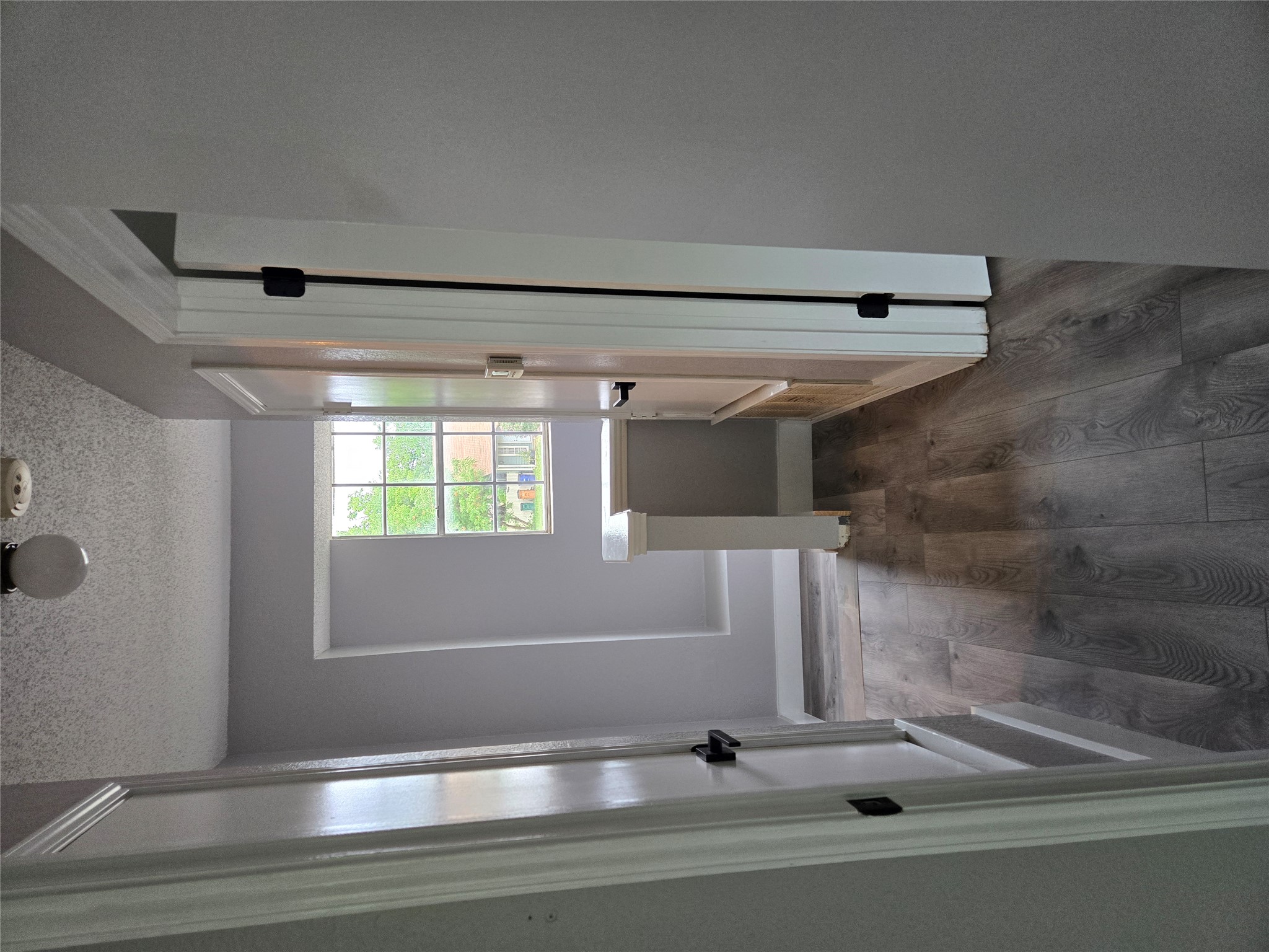 10001 Parliament House Road, Unit A Austin, TX 78729 - Photo 15 of 25 a view of a room with a hardwood and door