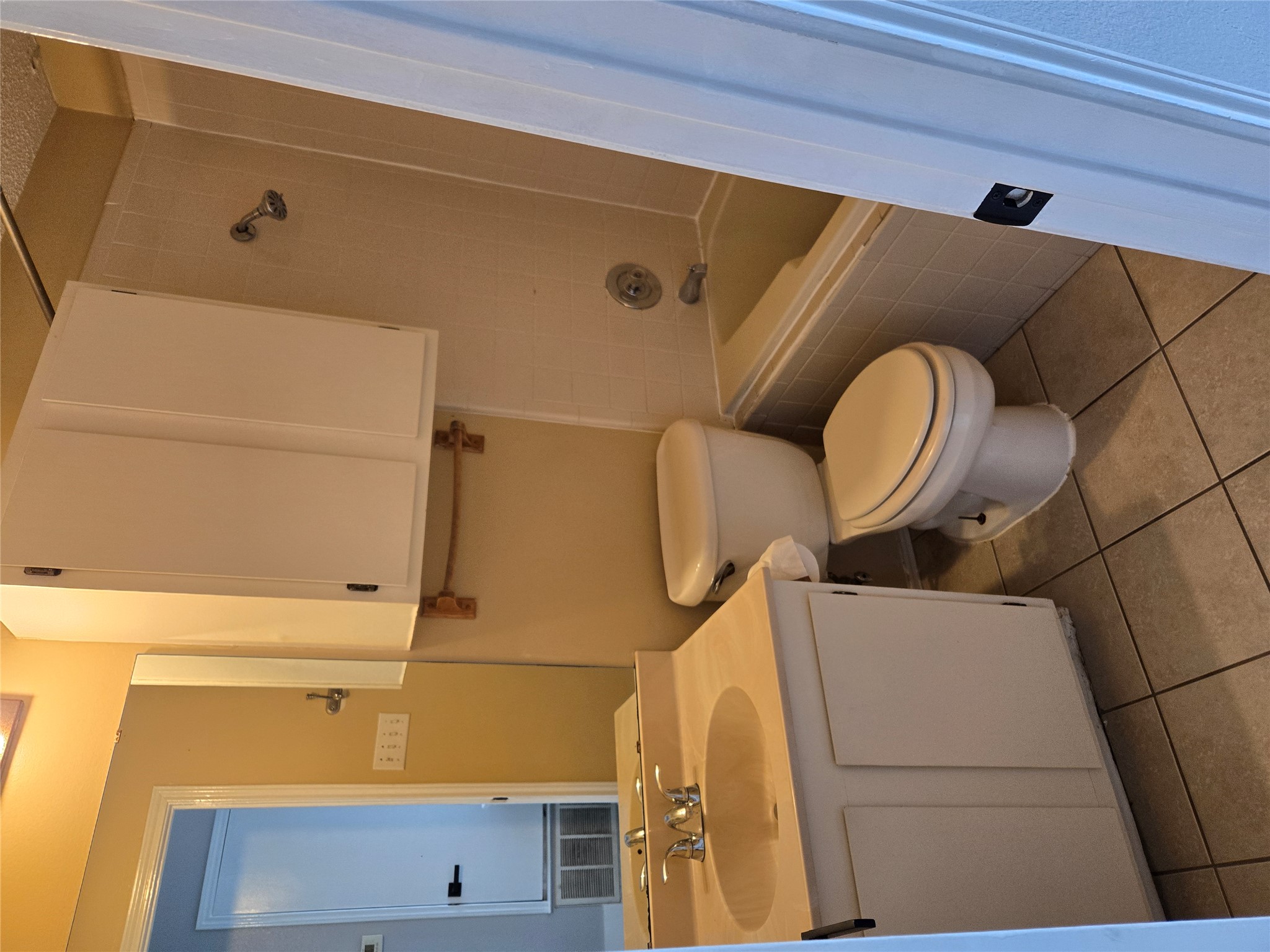 10001 Parliament House Road, Unit A Austin, TX 78729 - Photo 22 of 25 a bathroom with a sink and a toilet