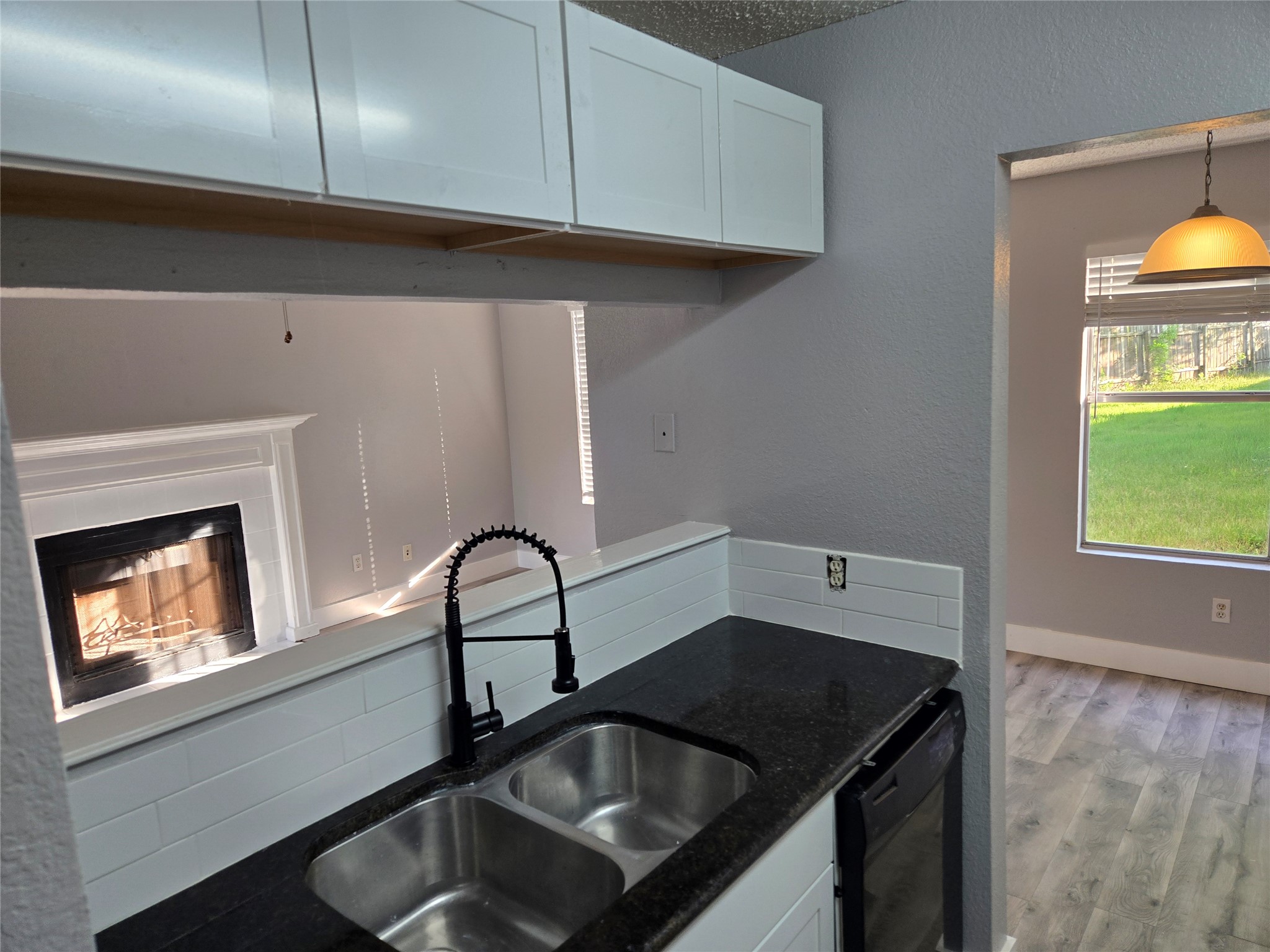10001 Parliament House Road, Unit A Austin, TX 78729 - Photo 3 of 25 a kitchen with a sink a stove and cabinets