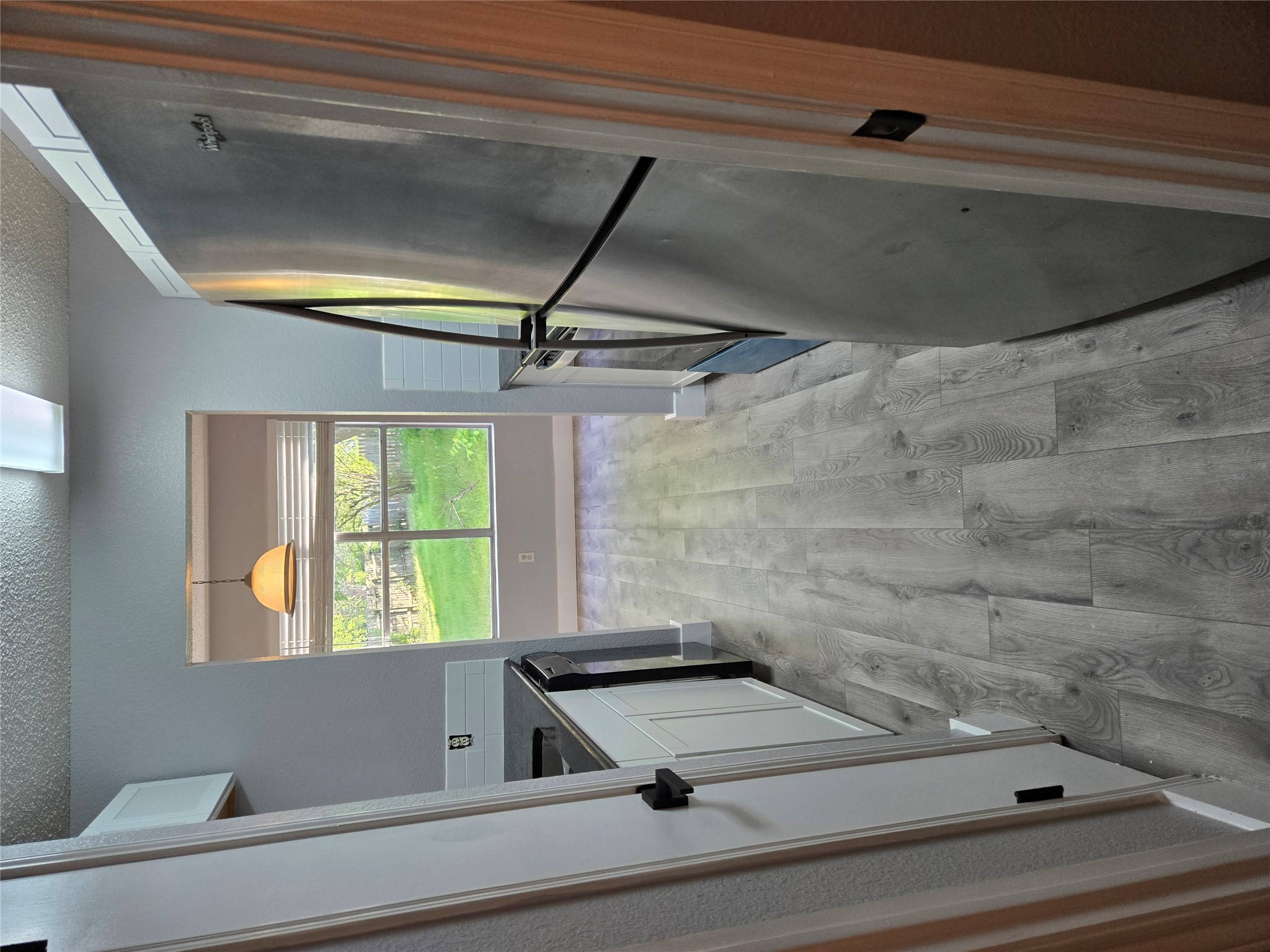 10001 Parliament House Road, Unit A Austin, TX 78729 - Photo 5 of 25 a view of a kitchen from a window