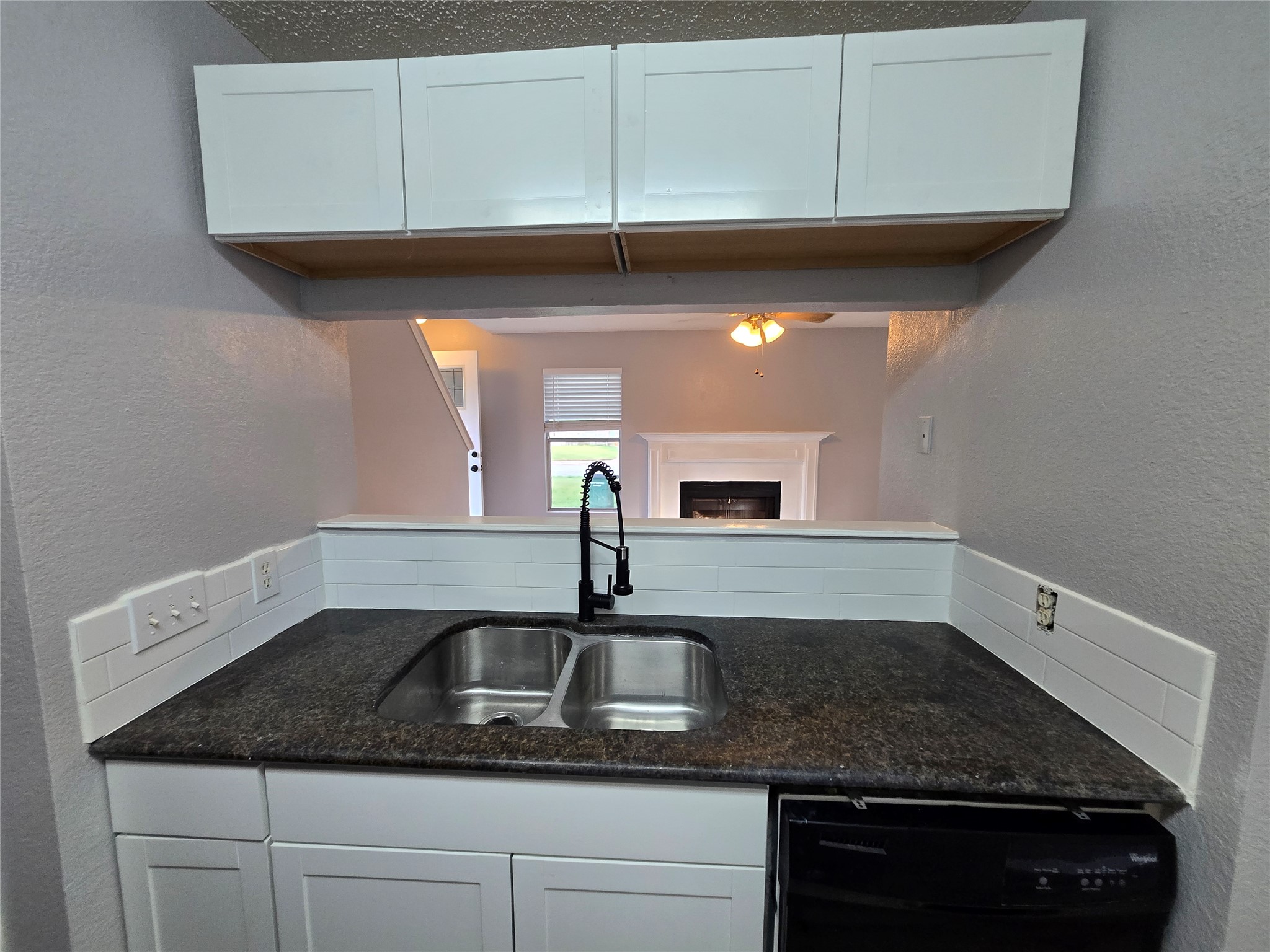 10001 Parliament House Road, Unit A Austin, TX 78729 - Photo 6 of 25 a kitchen with a sink and cabinets