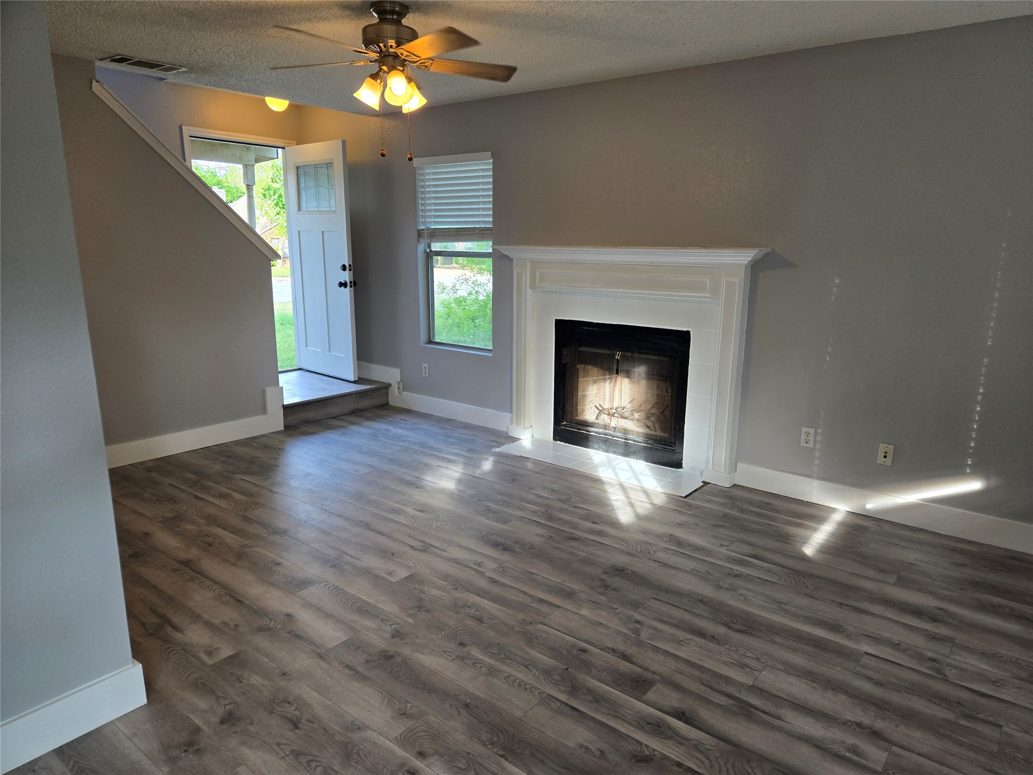 10001 Parliament House Road, Unit A Austin, TX 78729 - Photo 7 of 25 a view of an empty room with window and fire place
