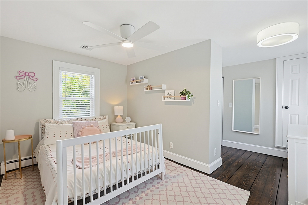 345 Sherman Street Canton, MA 02021 - Photo 22 of 42 a bed room with a bed and a window